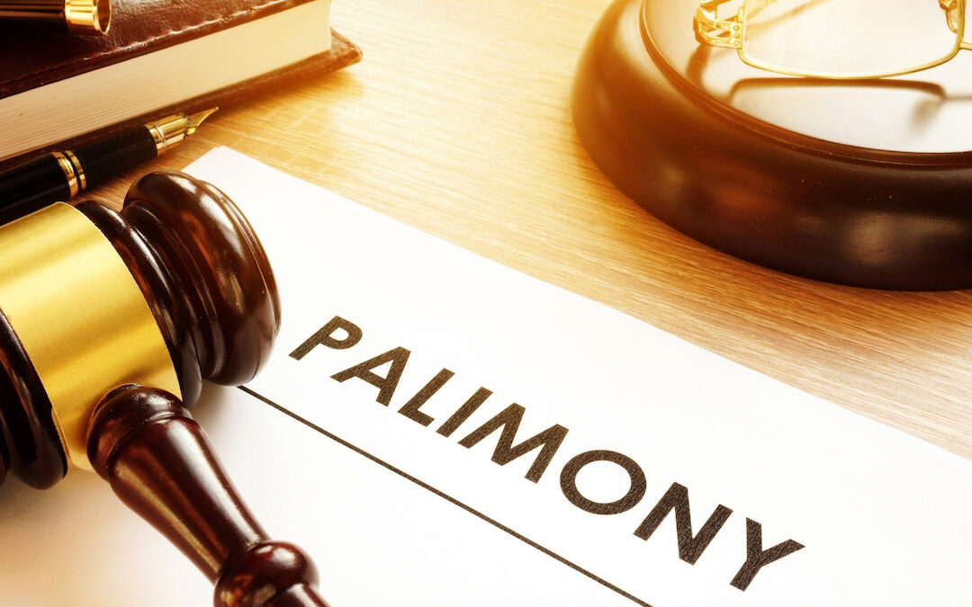 The word Palimony written on paper next to a judges hammer.